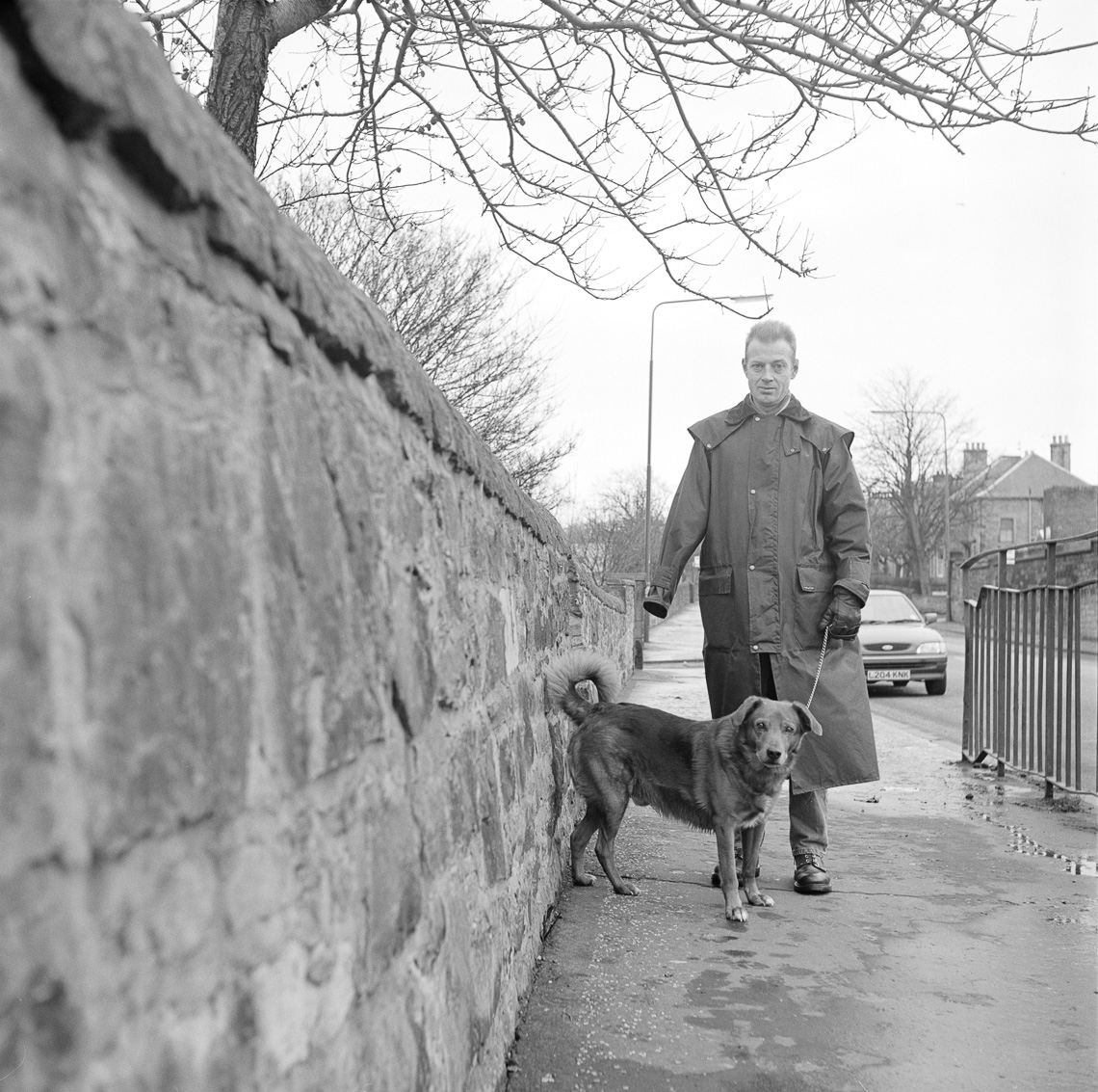 black-white-street-dog-man