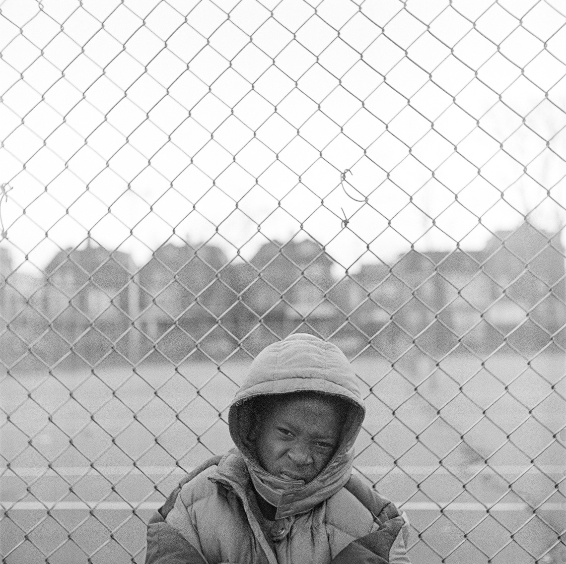 black-white-street-kid-fence-wind