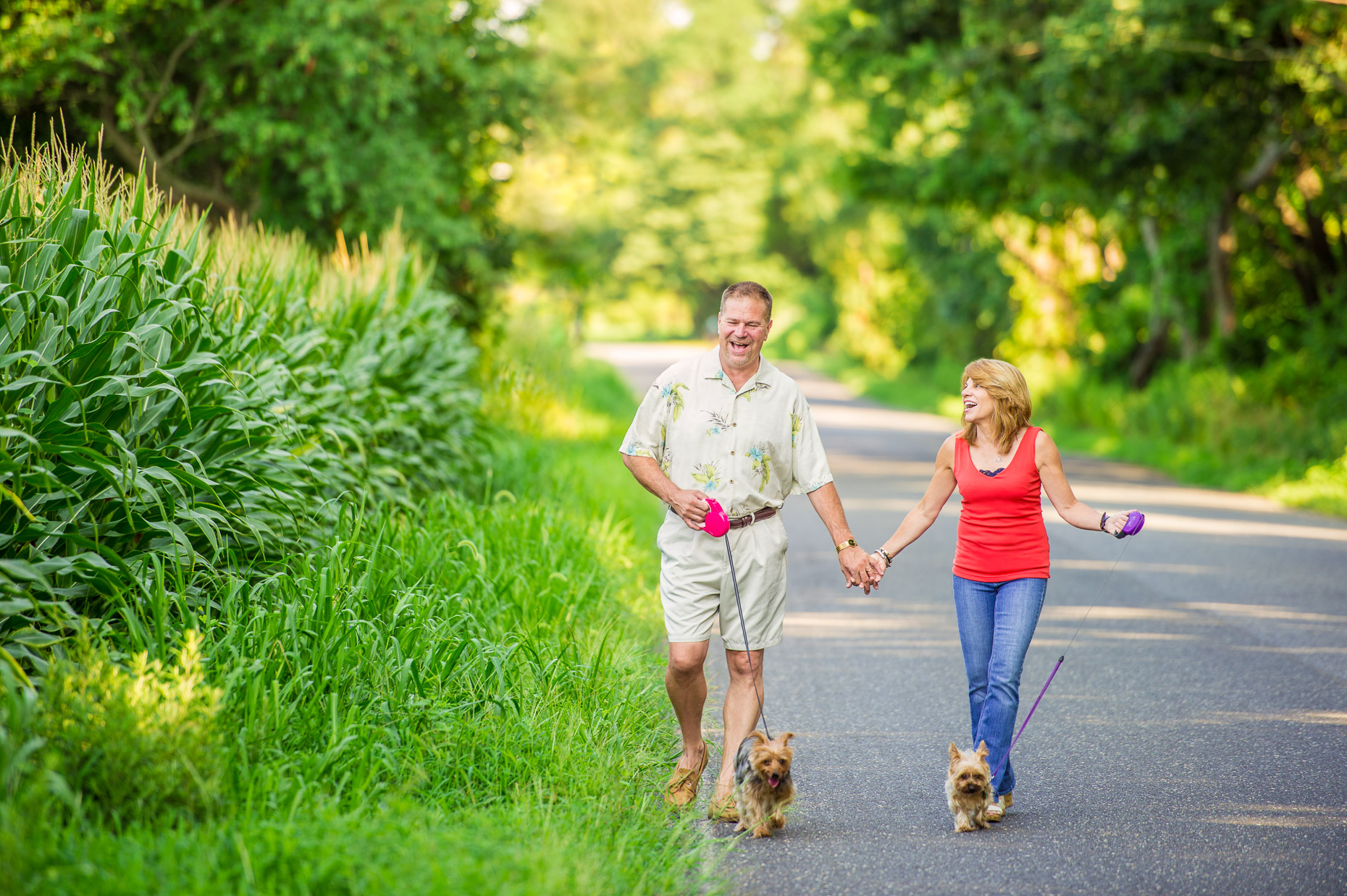 couple-walking-dogs-outdoors