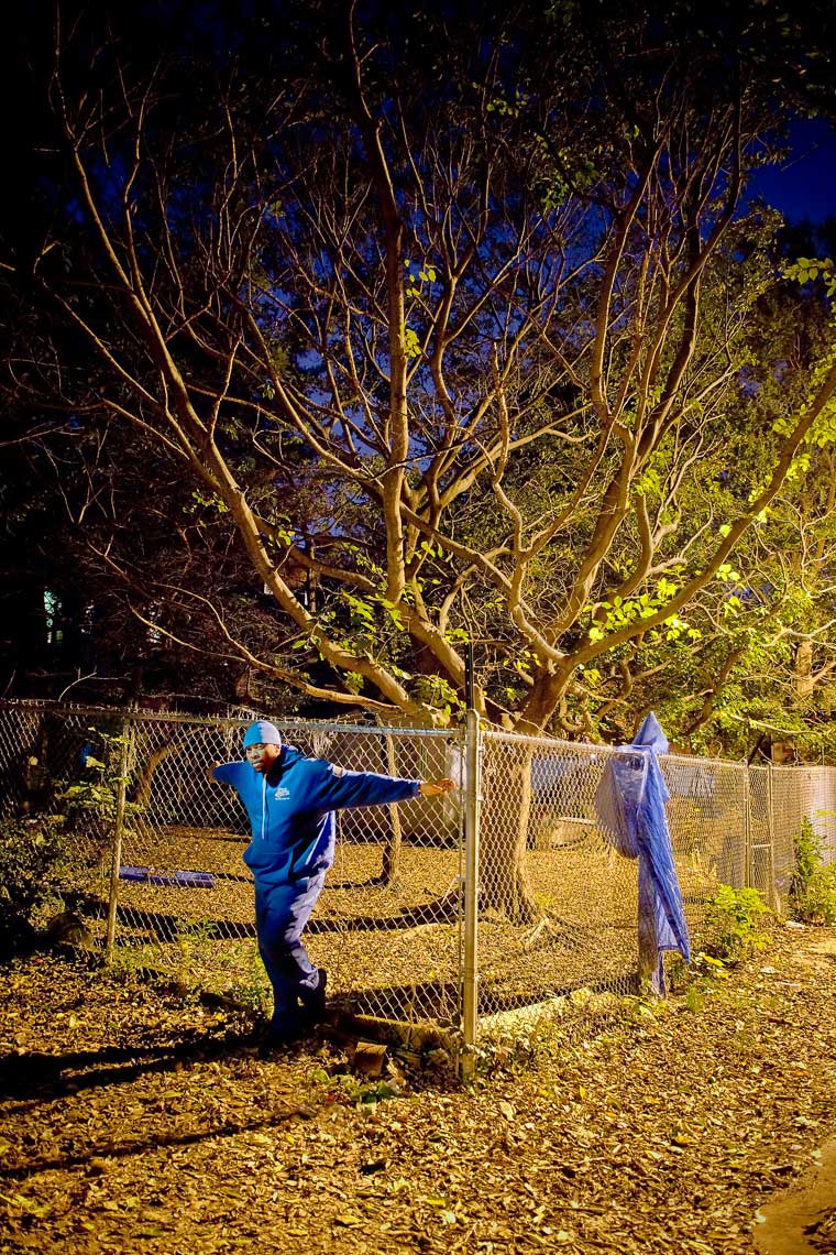 rwa-man-blue-hat-jacket-fence-tree-0132